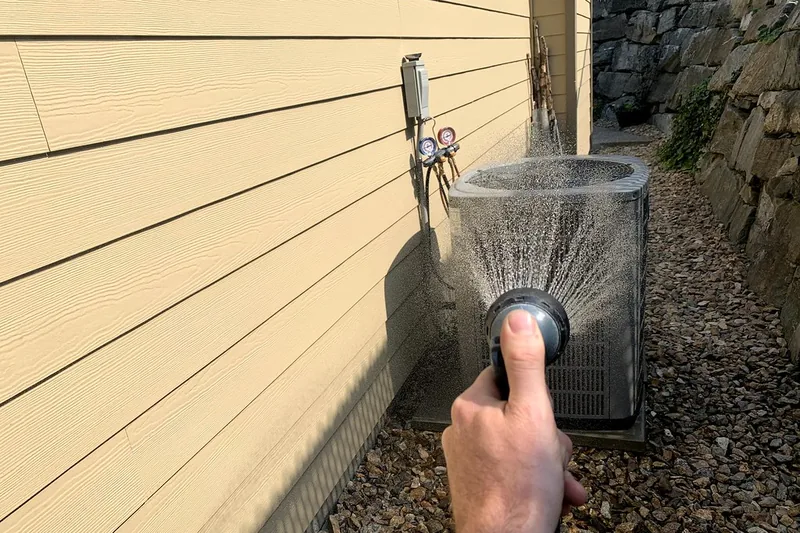 Technician working on an air conditioning unit